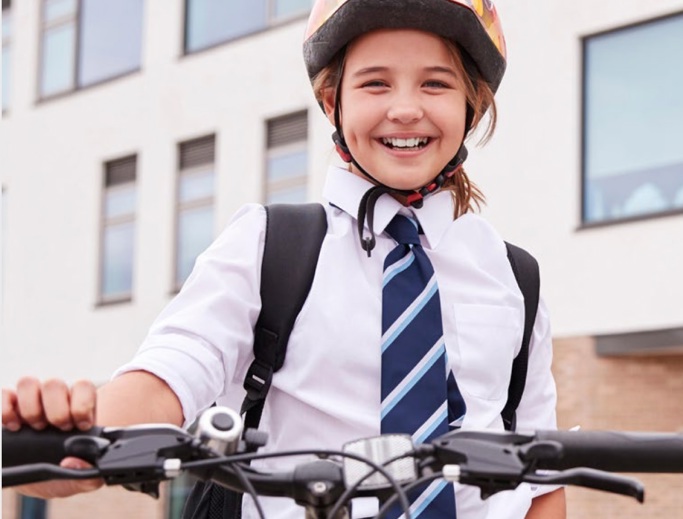 Close up of a school girl on her bicycle